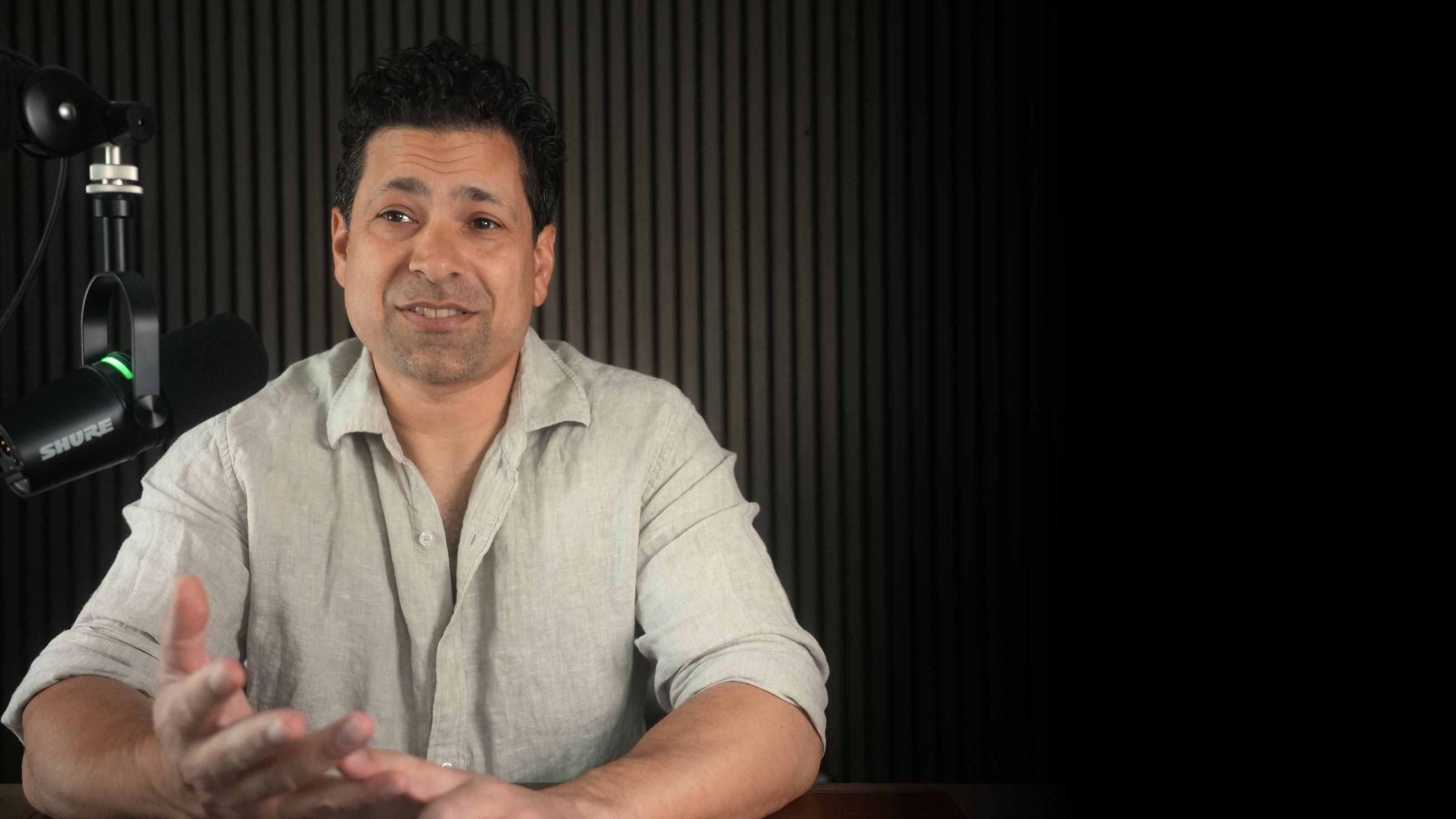 Dr. Ravi Kumar recording a podcast